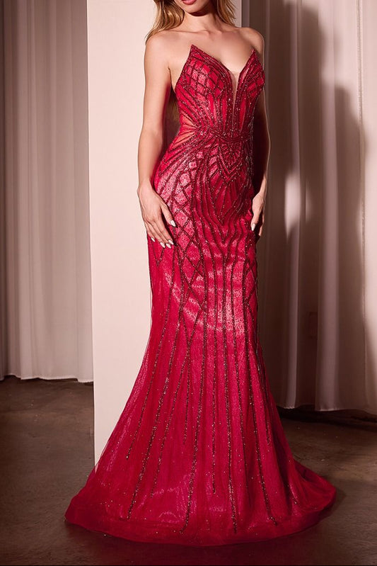 Woman wearing a red evening gown against a neutral background