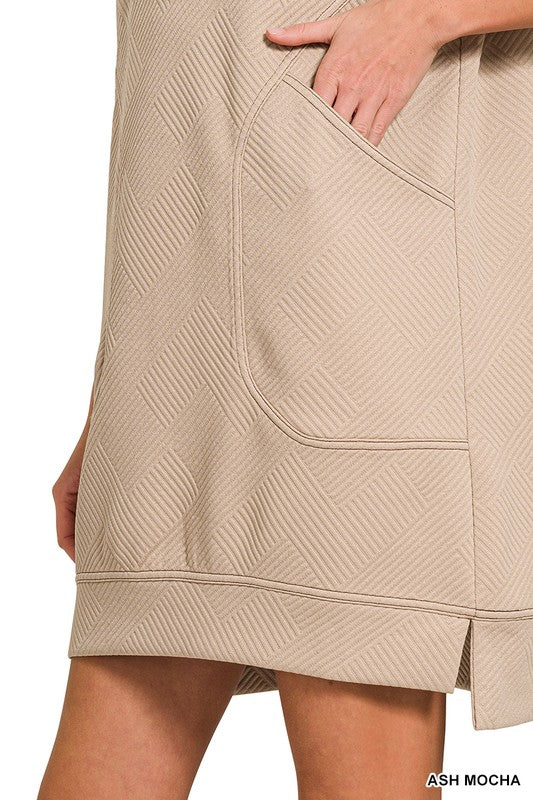 Beige textured skirt with a pocket detail on a white background