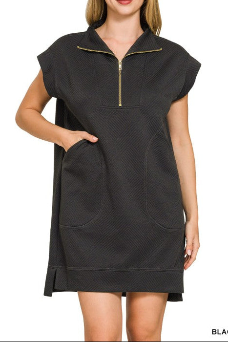 Woman wearing a black dress with a zipper on a white background
