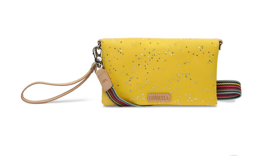 Yellow wristlet with star pattern on a white background